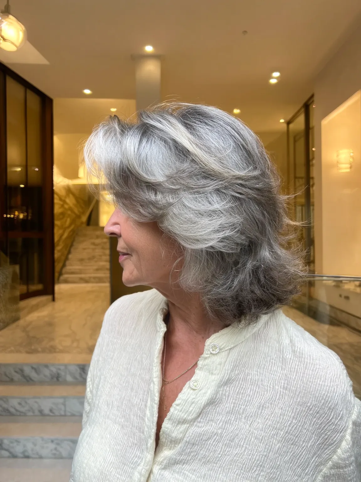 Wavy Silver Frost Layers with Side-Swept Bangs