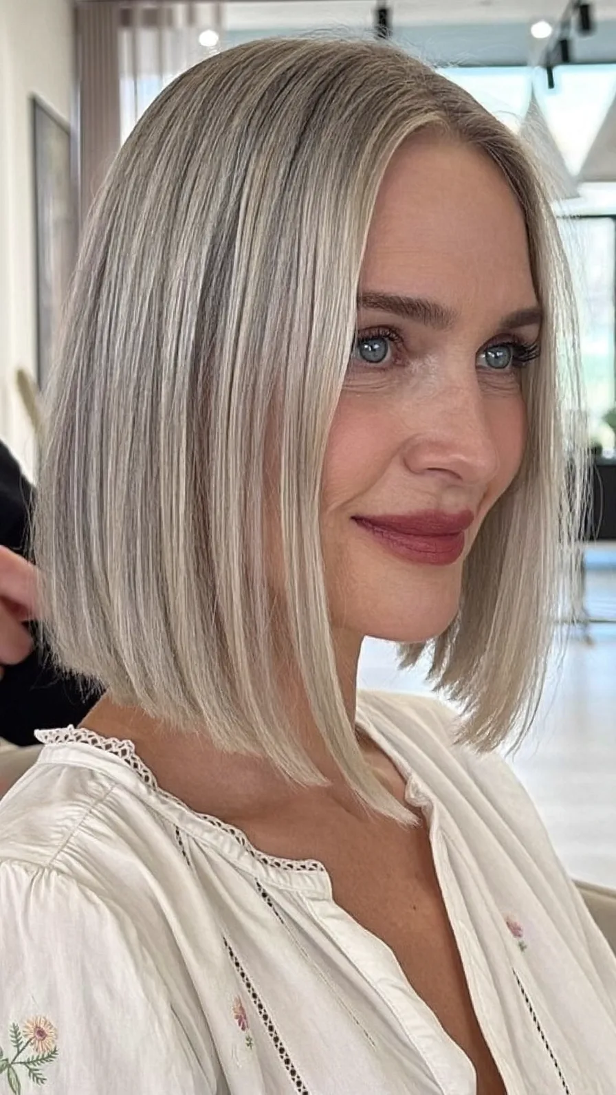Sleek Ash Blonde Blunt Bob with Curtain Bangs Style