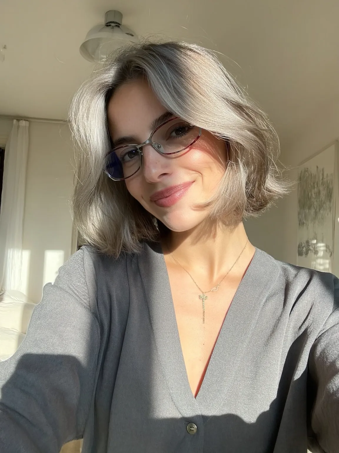 Silvery Ash Blonde Wavy Bob with Curtain Bangs and Body