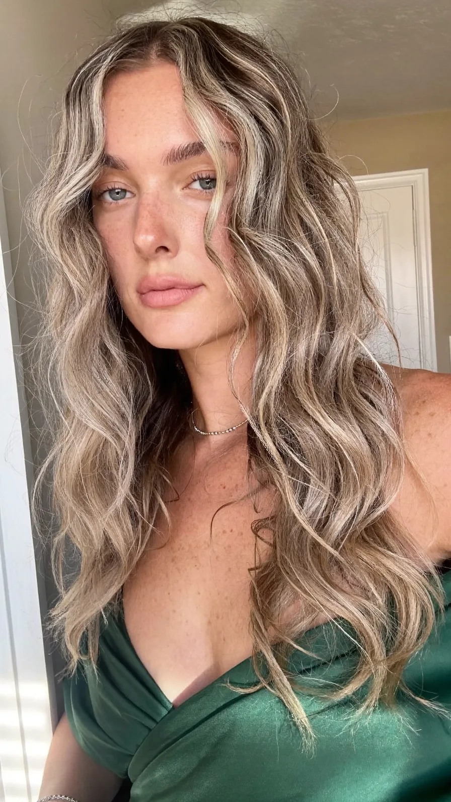 Voluminous Long Layers with Curtain Bangs and Beach Waves
