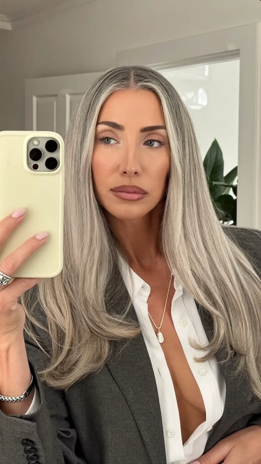 Sleek Silver Ash Blonde Long Layered Hair with Center Part