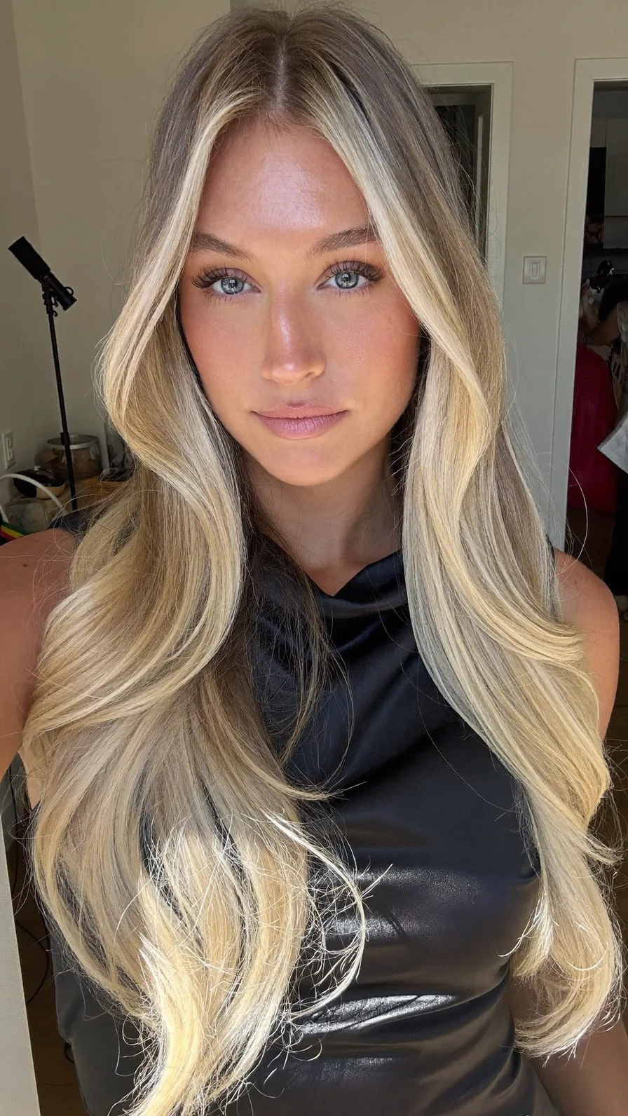 Voluminous Long Layered Blonde Hair with Curtain Bangs