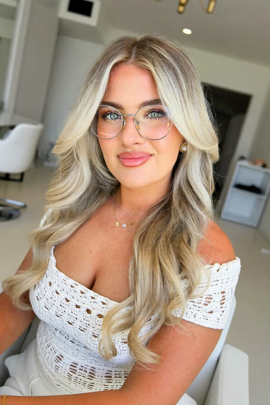 Soft Ash Blonde Waves with Voluminous Face-Framing Layers