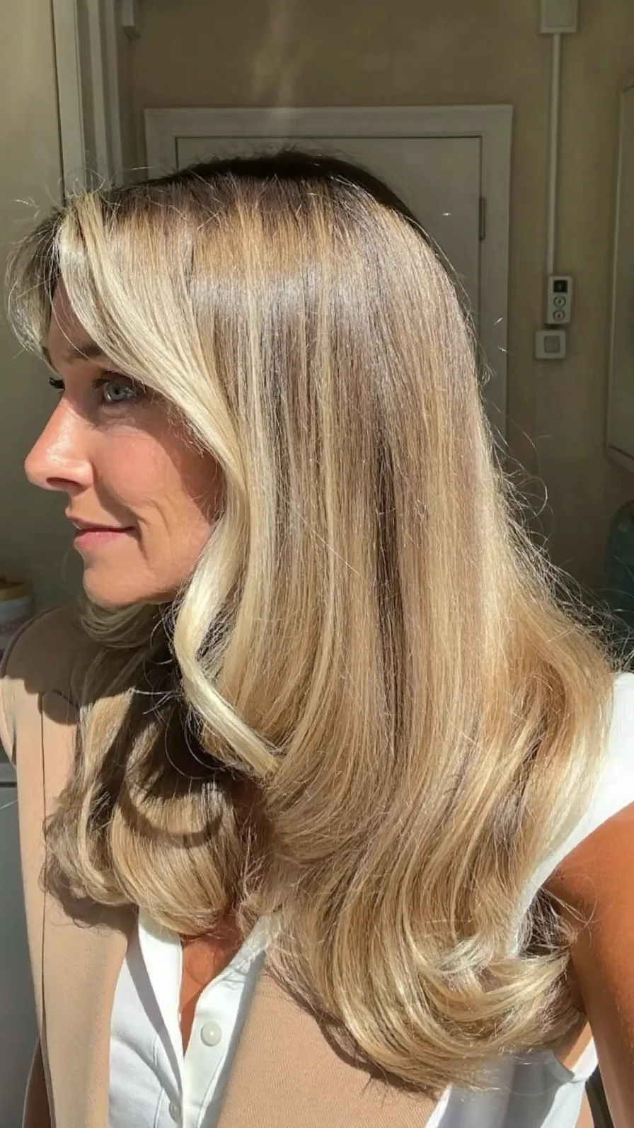 Sophisticated Golden Blonde Curtain Bangs with Long Layers