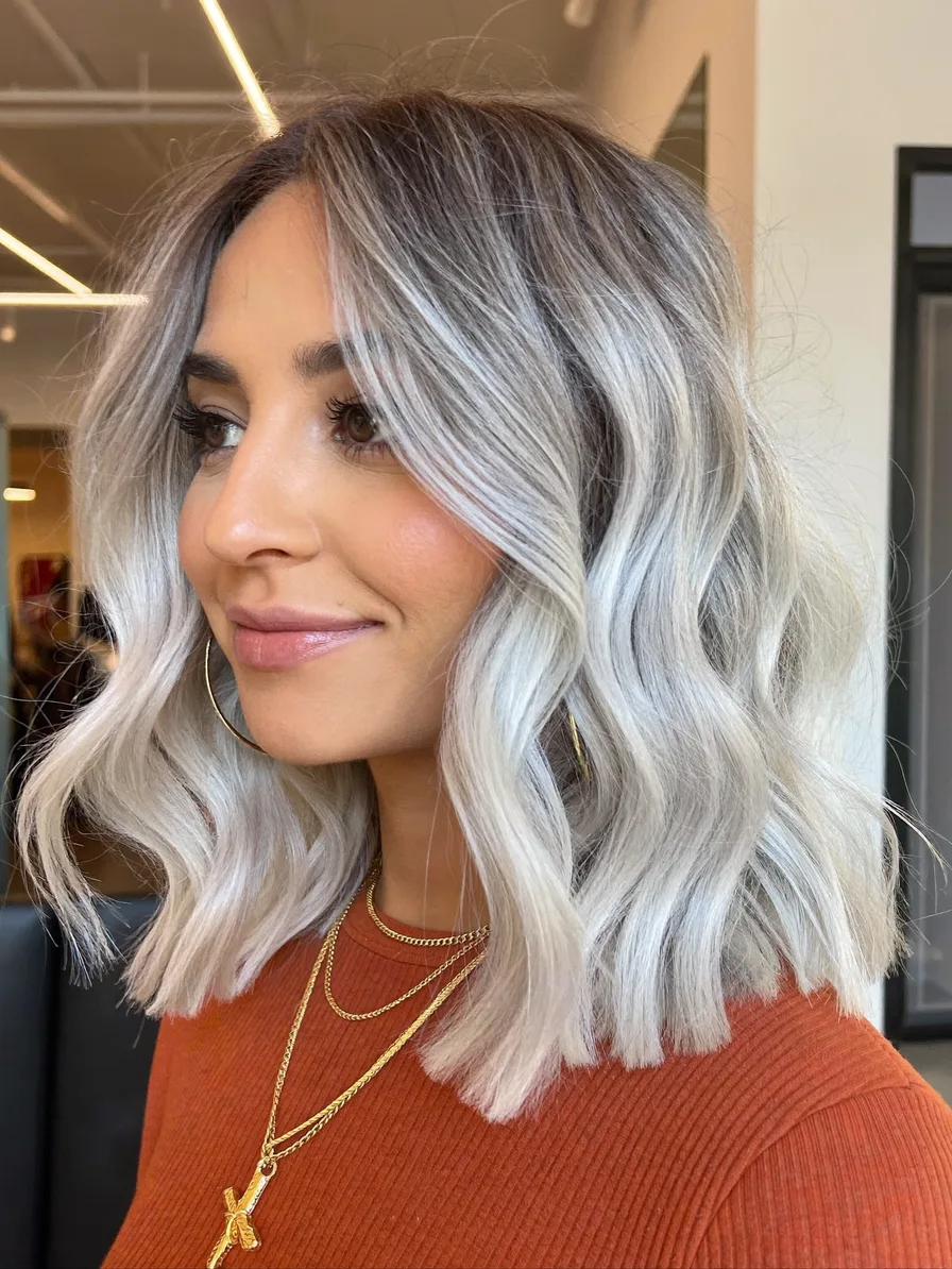 Modern Ash Blonde Shoulder-Length Lob with Curtain Bangs