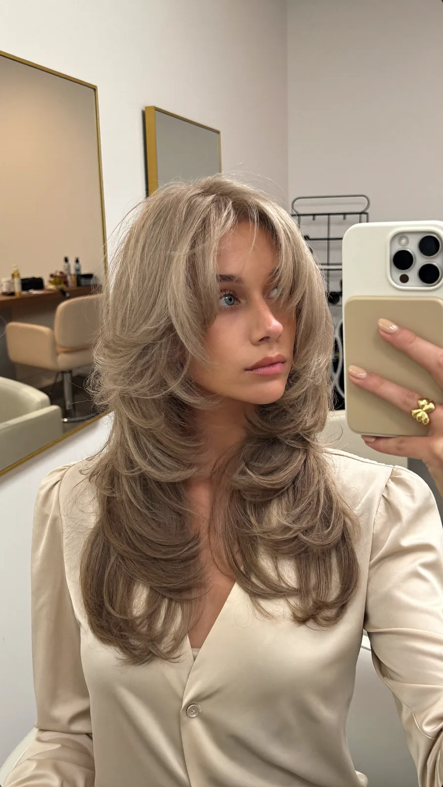 Long Layered Feathered Cut with Voluminous Curtain Bangs