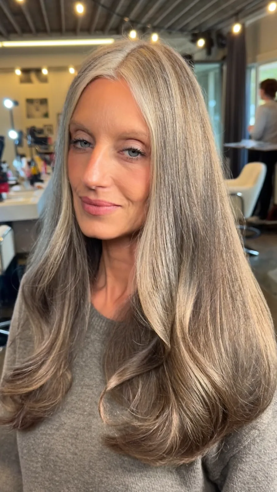 Elegant Long Layers with Center Part and Ash Blonde Highlights