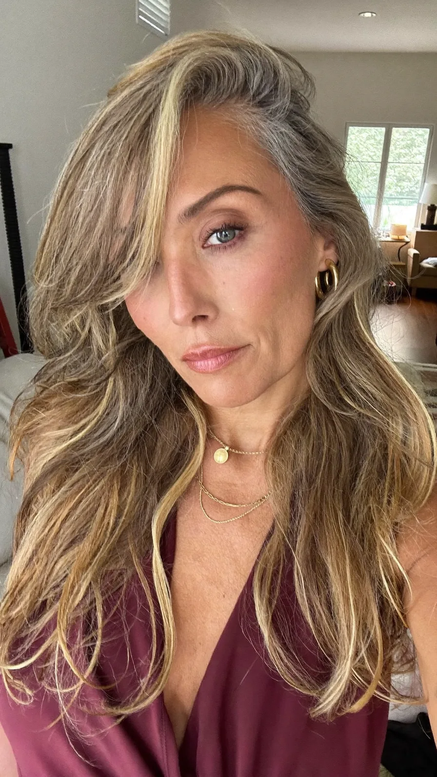 Long Layered Wavy Hair with Side-Swept Blonde Balayage Highlights