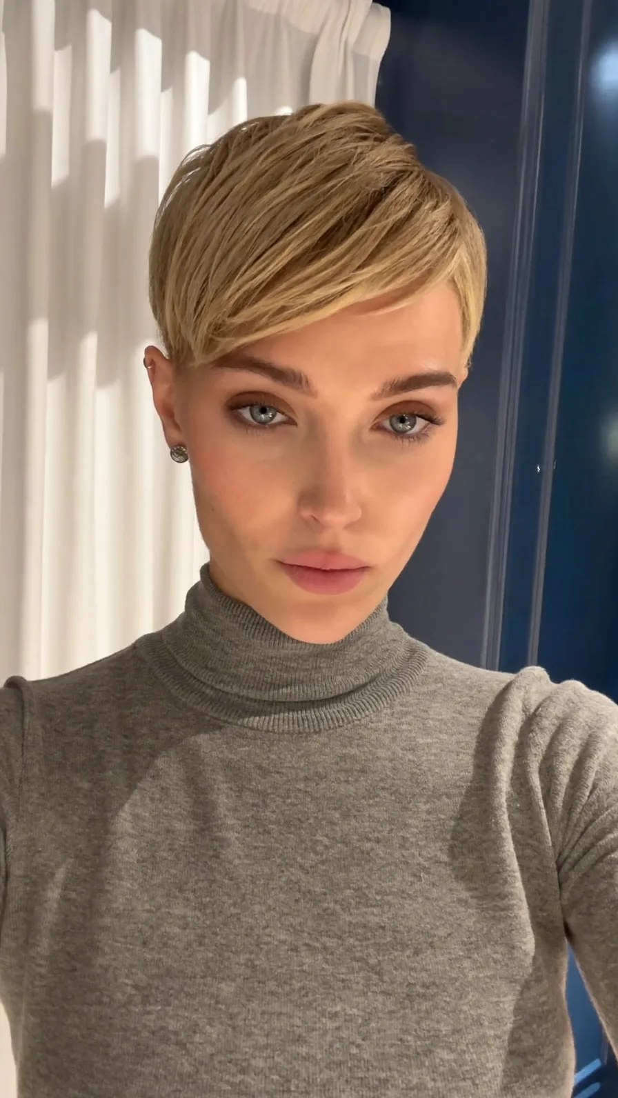 Sleek Side-Swept Ash Blonde Pixie with Blunt Ends