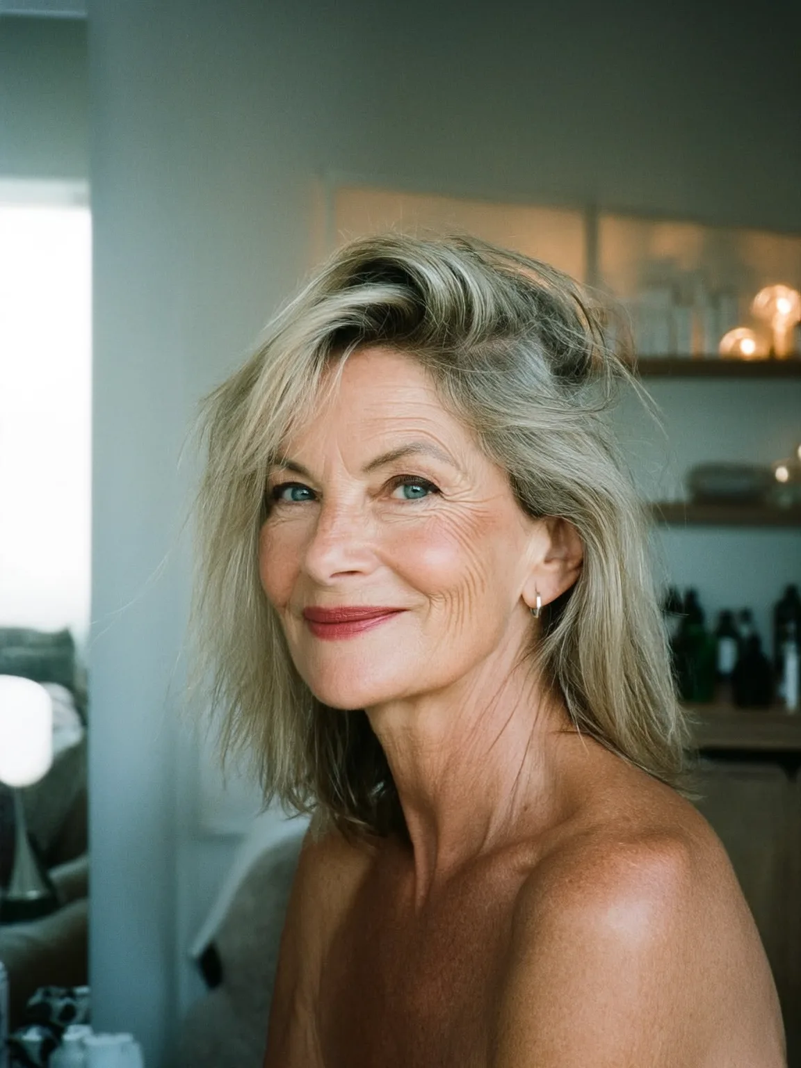 Voluminous Wavy Layers with Side-Swept Bangs in Cool Ash Blonde
