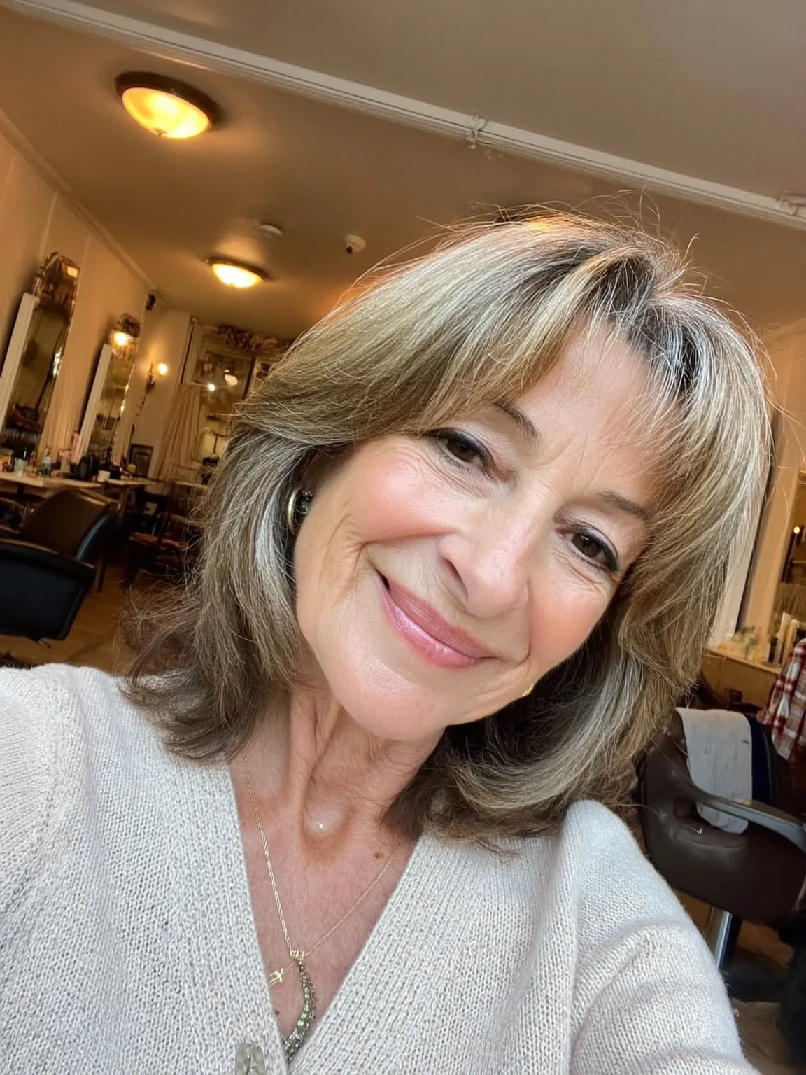 Medium-Length Layered Ash Blonde with Curtain Bangs