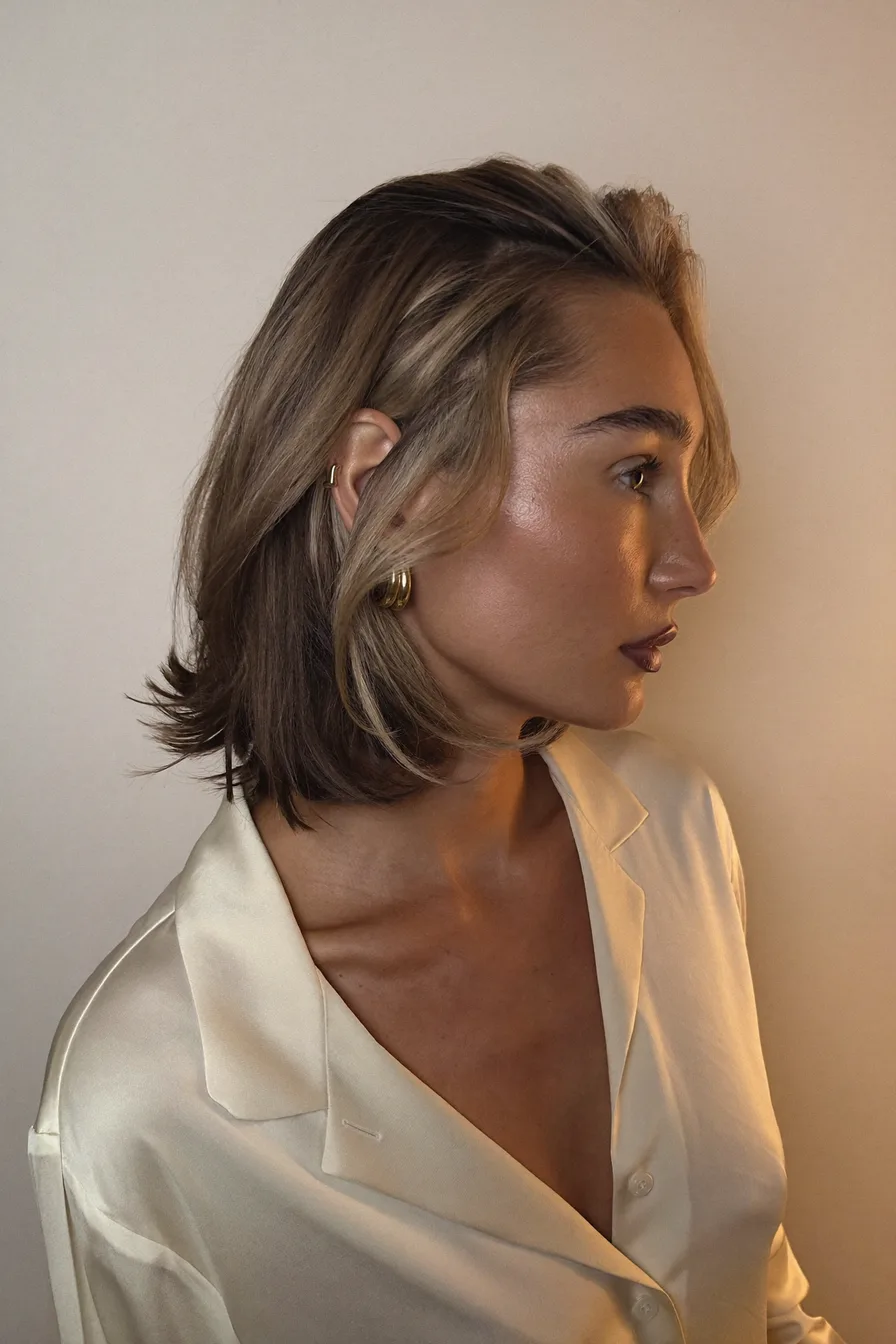 Elegant Ash Brown Side-Swept Bob with Flicked Ends