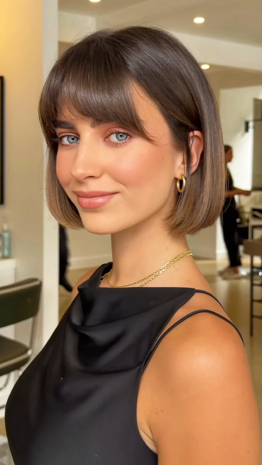 Sleek Chin-Length Bob with Curtain Bangs for Modern Elegance