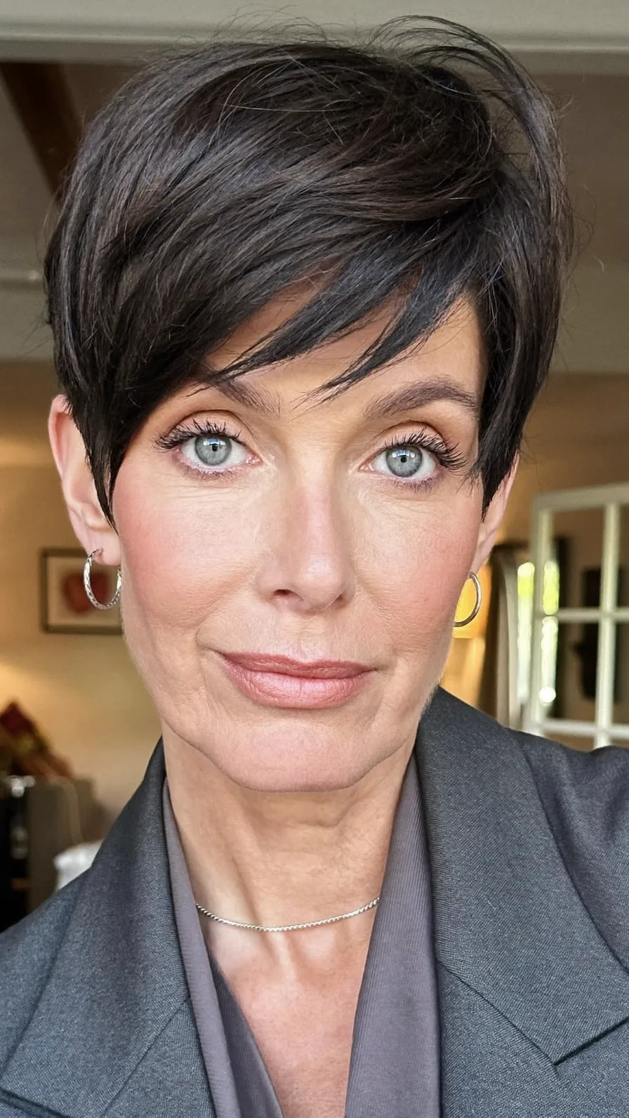 Chic Textured Dark Ash Brown Pixie with Side-Swept Bangs