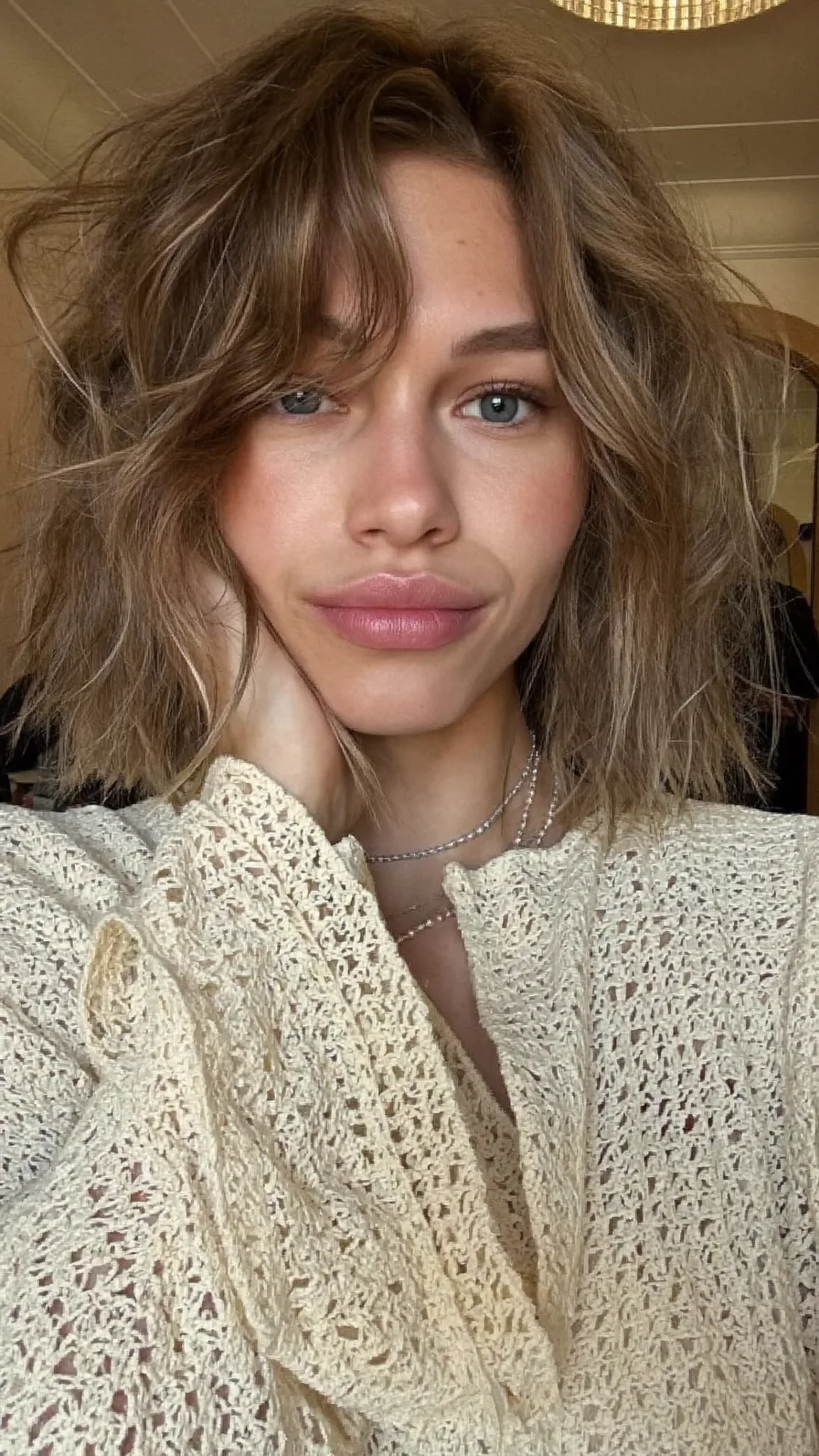 Textured Shoulder-Length Shag with Curtain Bangs and Balayage Highlights