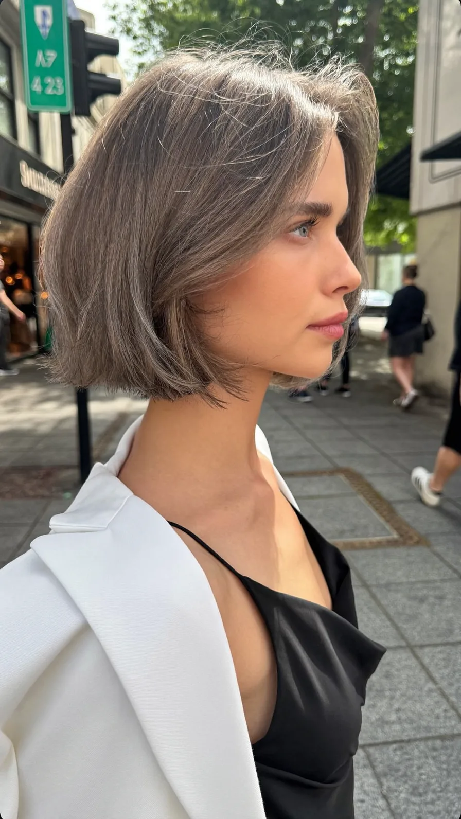 Sleek Chin-Length Ash Brown Bob with Curtain Bangs