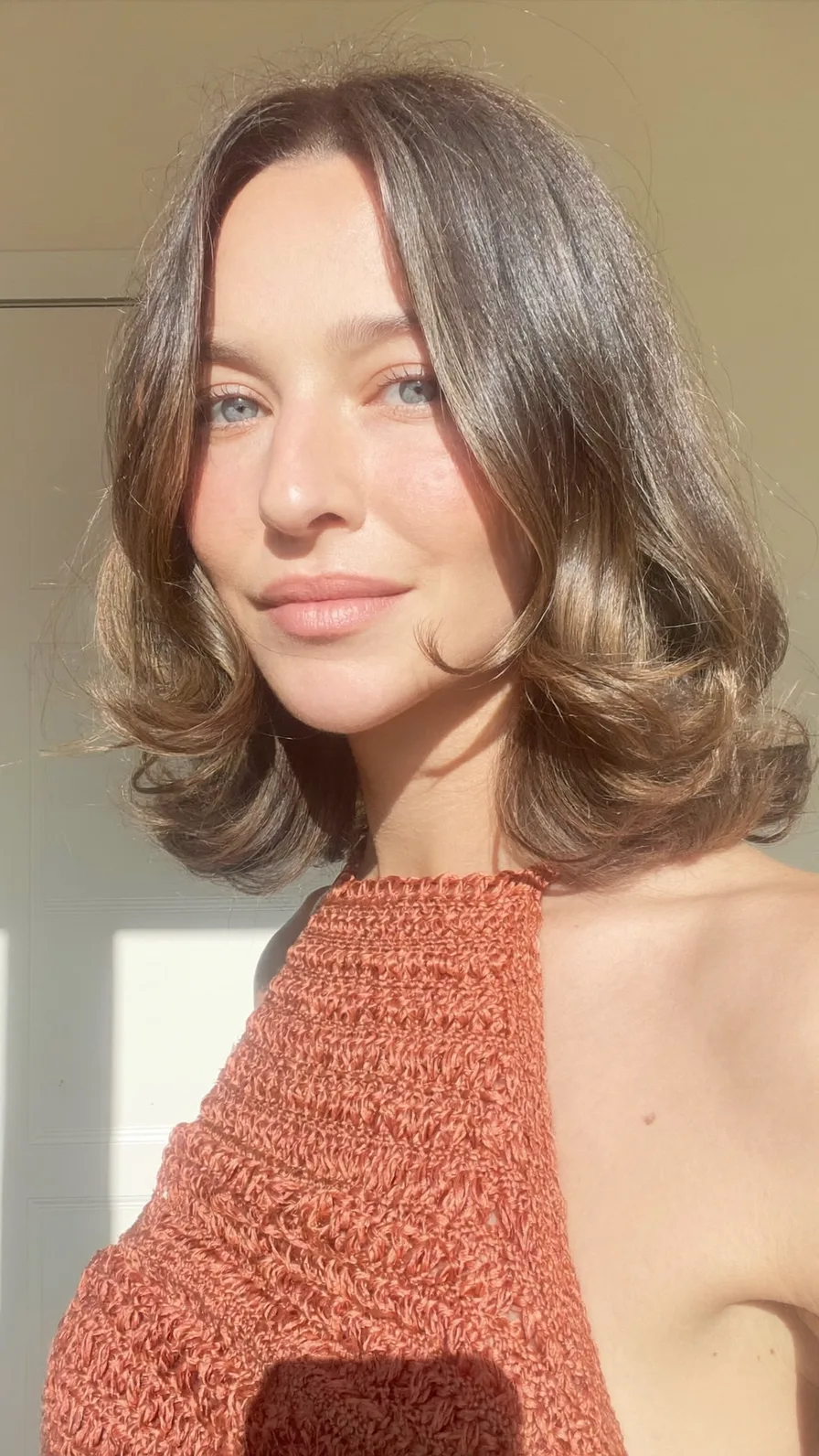 Medium Layered Lob with Curtain Bangs and Subtle Balayage Highlights
