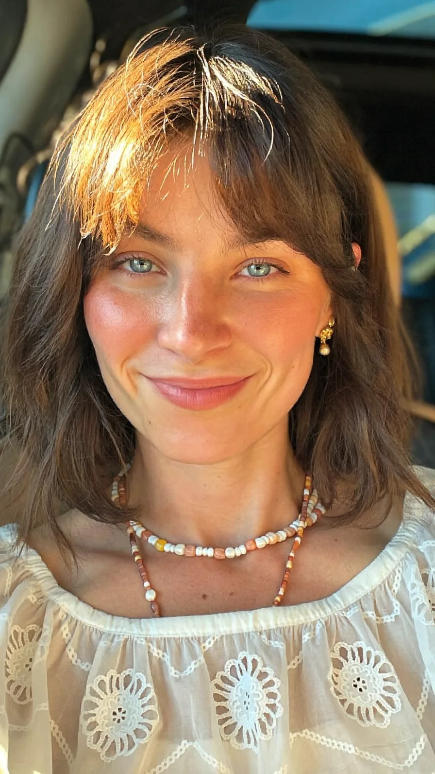 Soft Layered Shoulder-Length Lob with Curtain Bangs