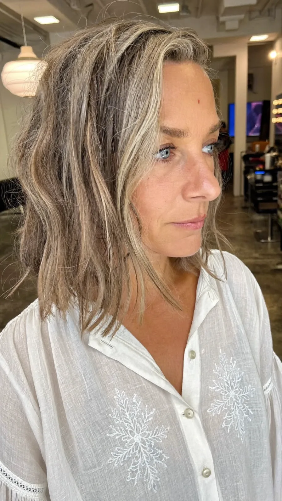 Textured Wavy Lob with Money-Piece Highlights and Side Swept Bangs