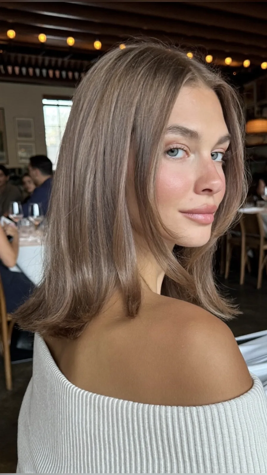 Flowing Shoulder-Length Ash Brown Lob with Flicked Ends