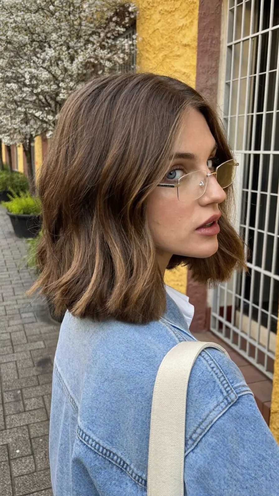 Modern Shoulder-Length Lob with Side-Swept Warm Highlights