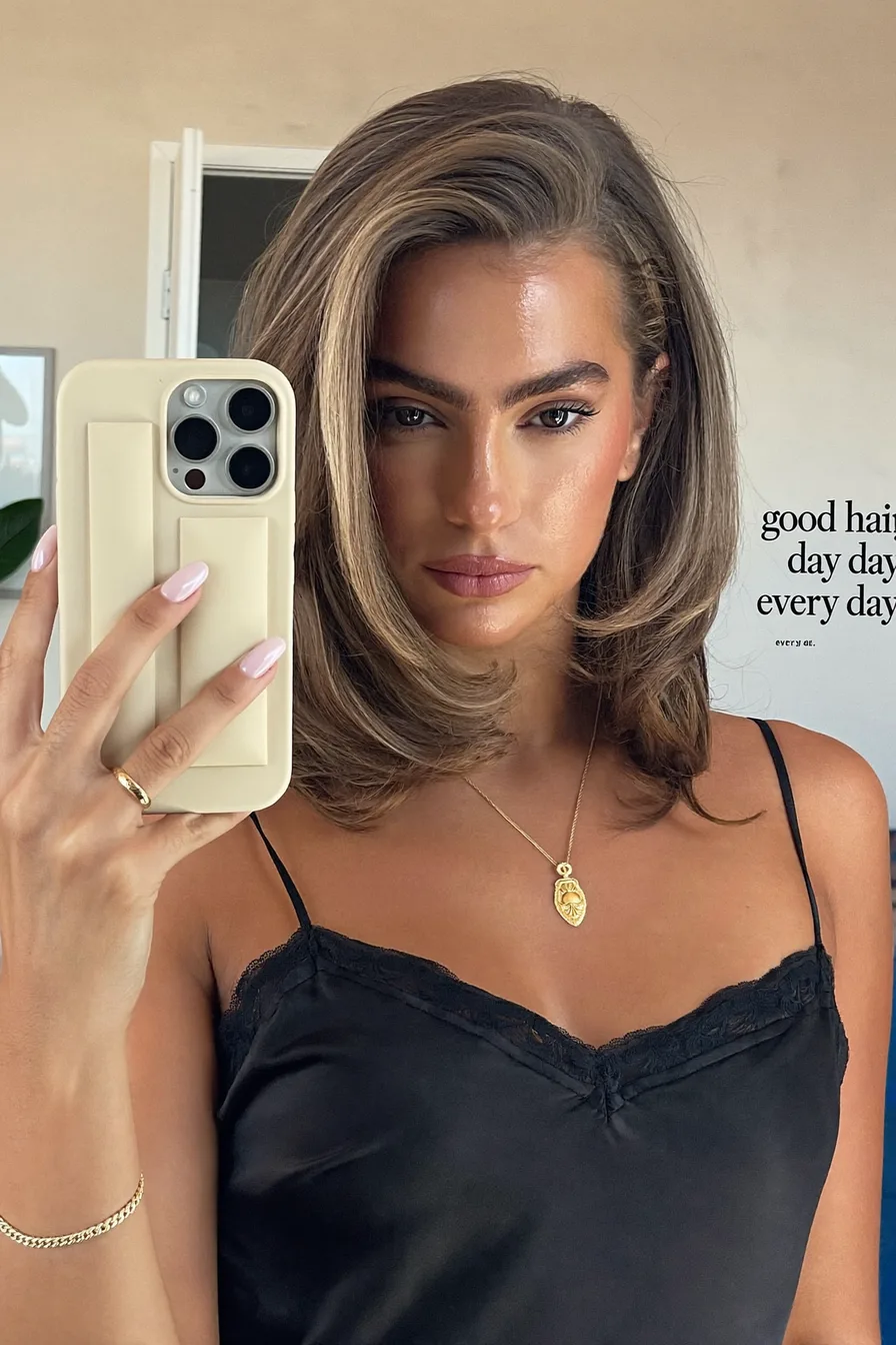Voluminous Shoulder-Length Lob with Deep Side Part Styling