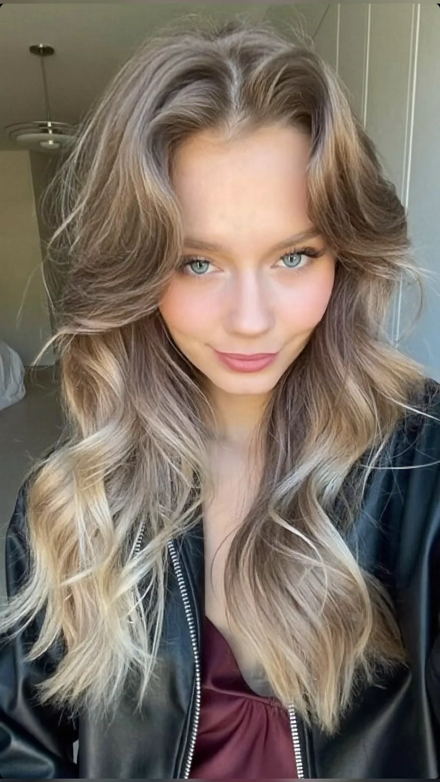 Voluminous Long Layers with Flowing Curtain Bangs and Balayage