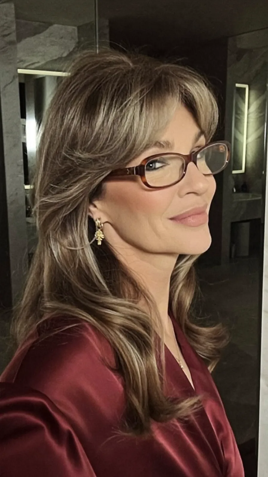 Elegant Long Layered Hair with Curtain Bangs and Balayage Highlights