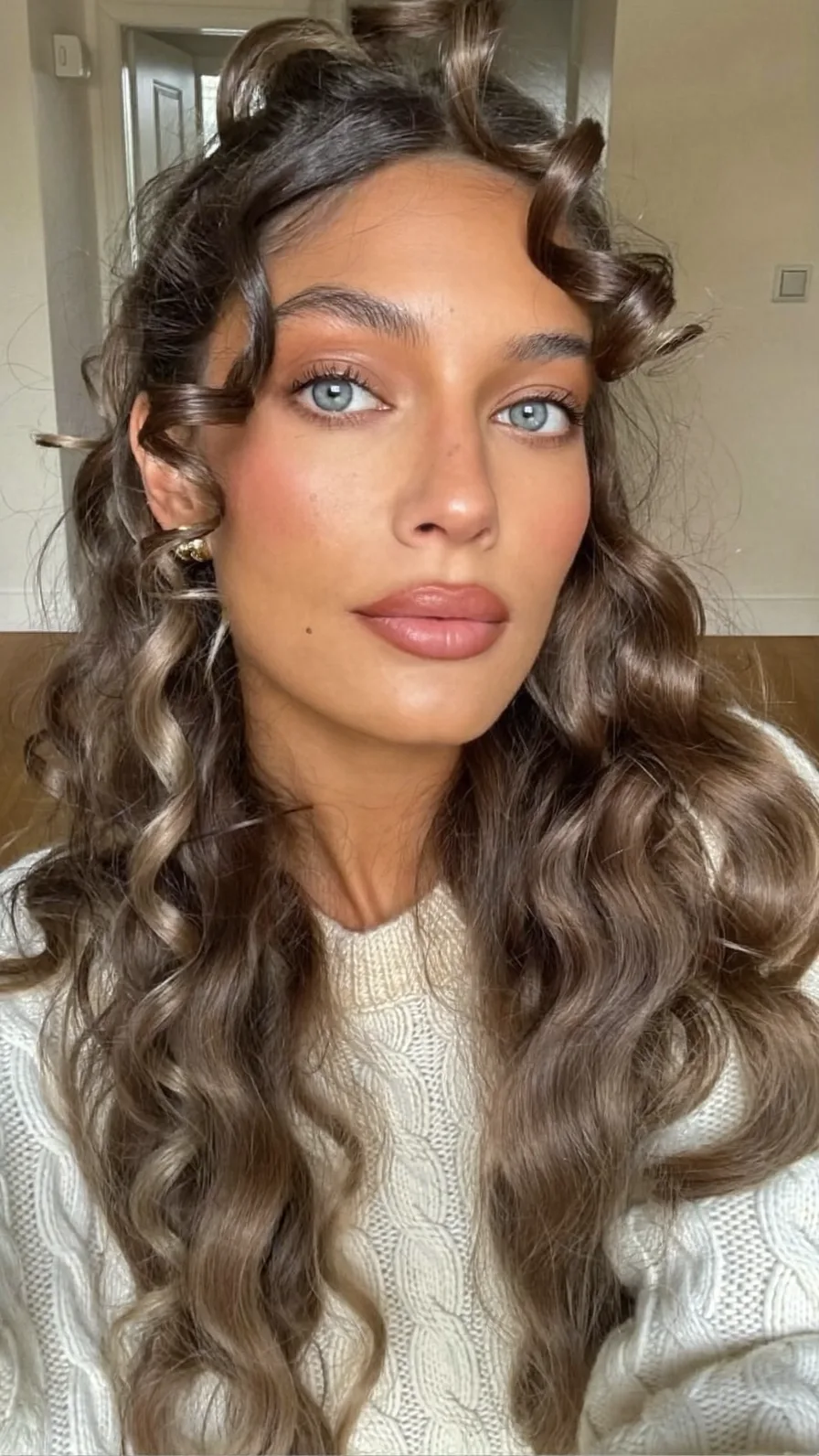 Long Layered Curly Hair With Soft Face-Framing Highlights