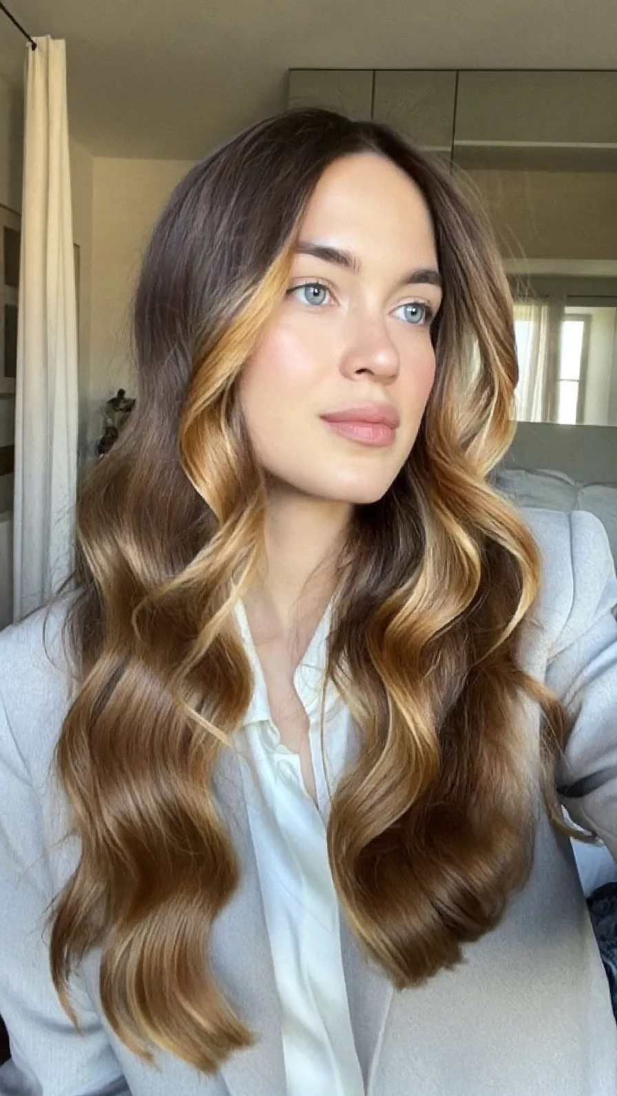 Long Flowing Waves with Warm Honey Blonde Balayage Highlights