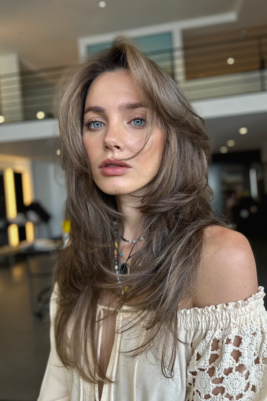 Long Layered Feathered Cut with Curtain Bangs Style