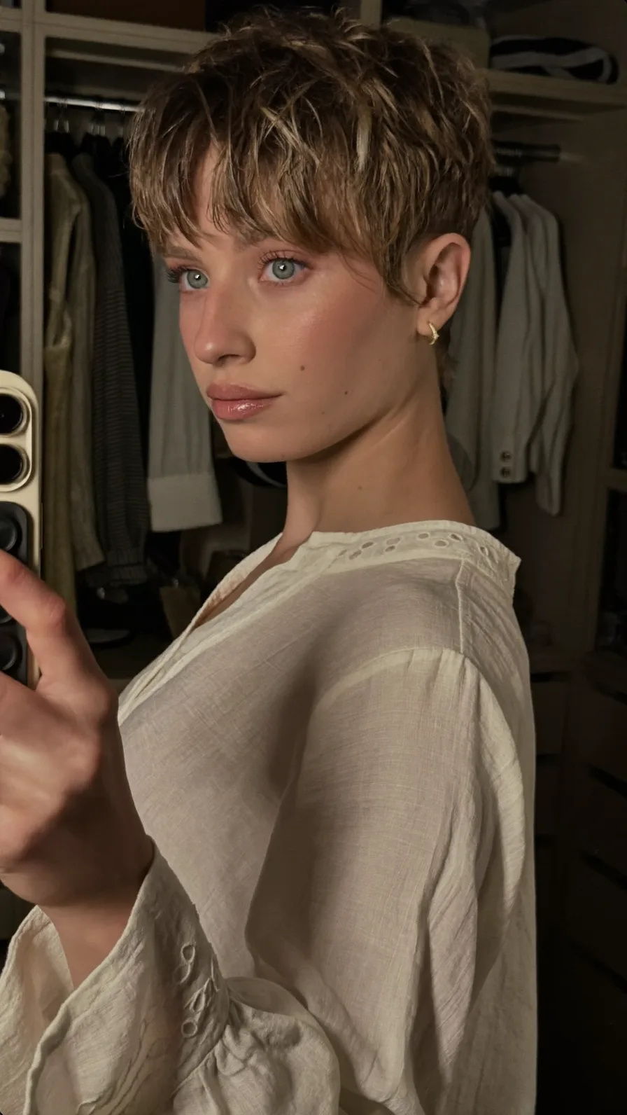Textured Short Pixie Cut with Curtain Bangs and Subtle Highlights