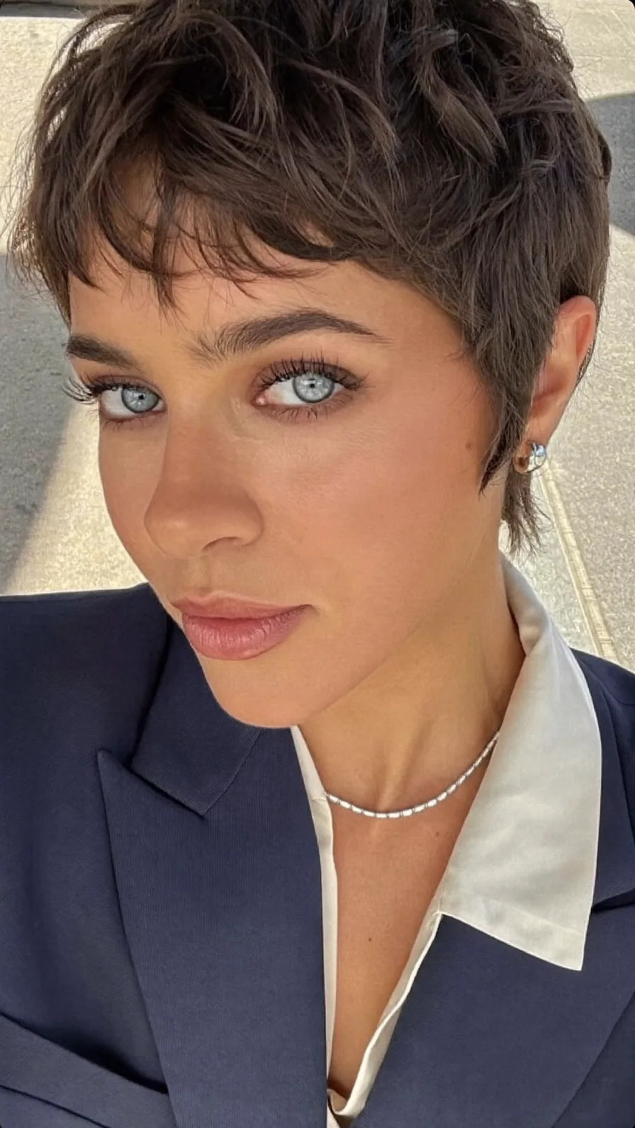 Textured Wavy Pixie Cut with Wispy Side-Swept Bangs