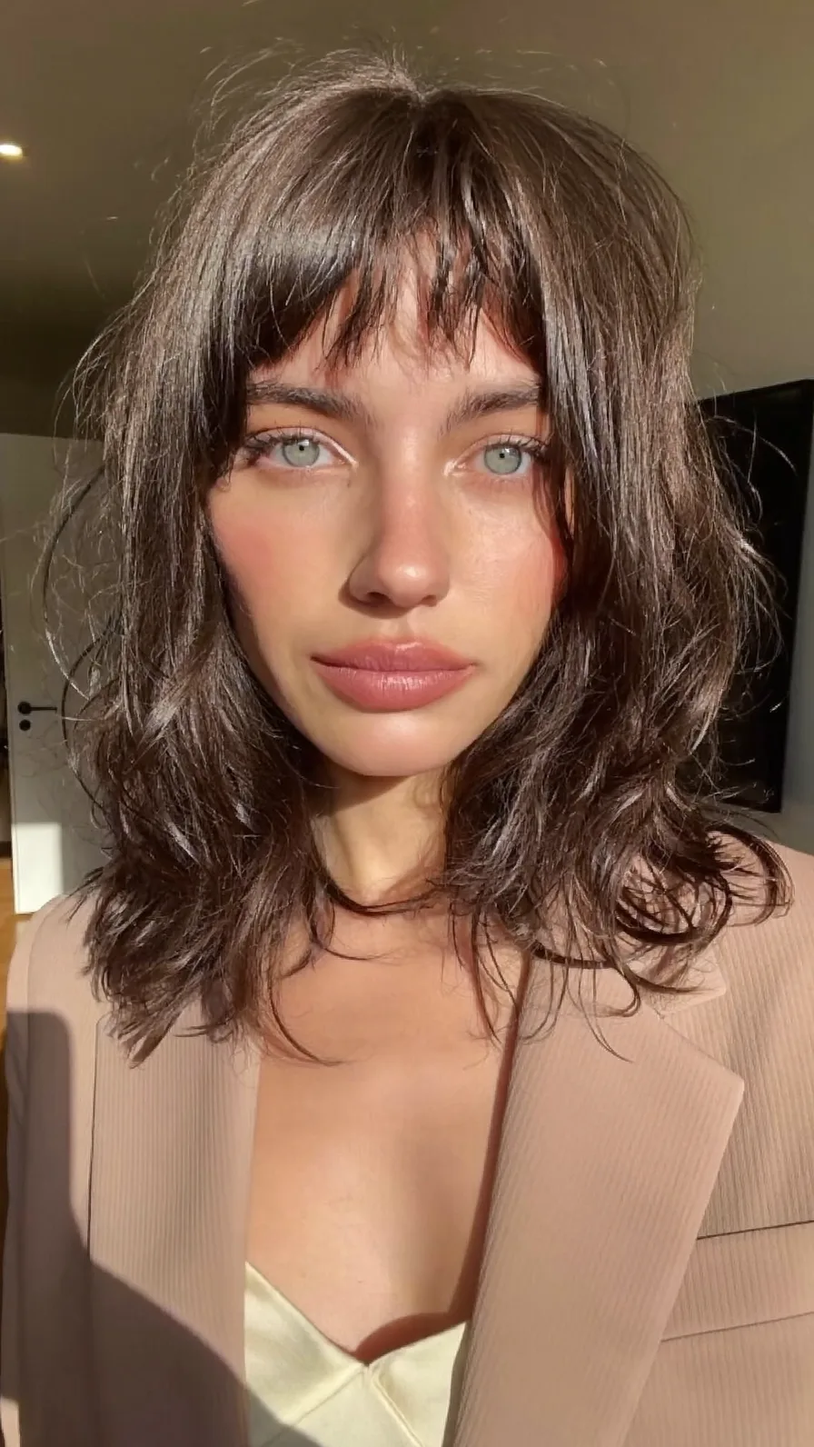 Textured Shoulder-Length Shag with Wispy Bangs