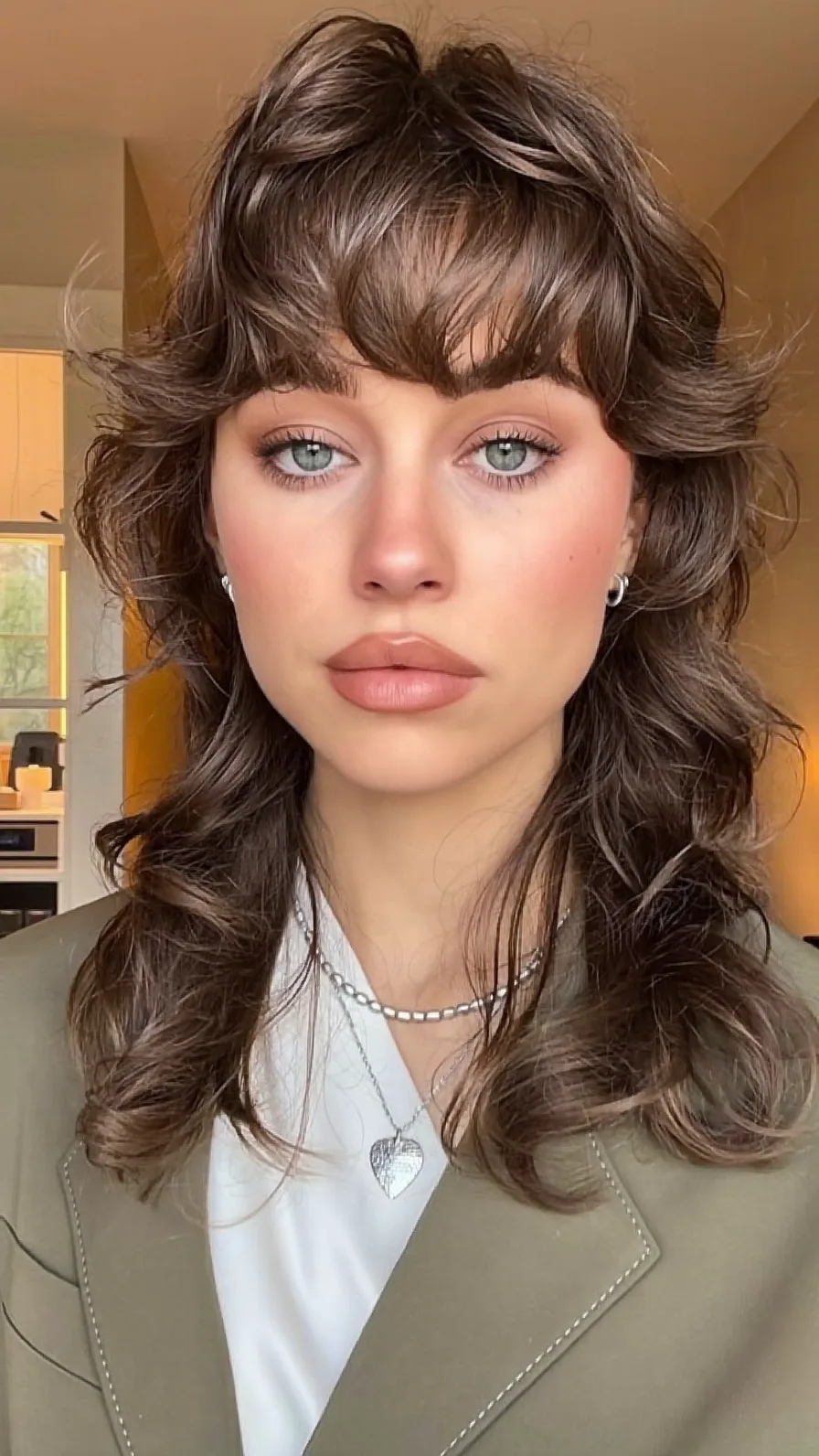 Wavy Shoulder-Length Shag with Textured Curtain Bangs