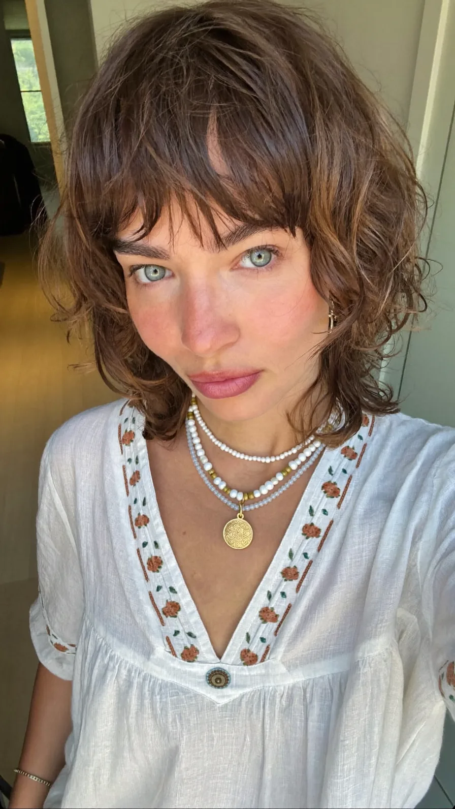 Textured Shoulder-Length Shag with Wispy Bangs and Highlights