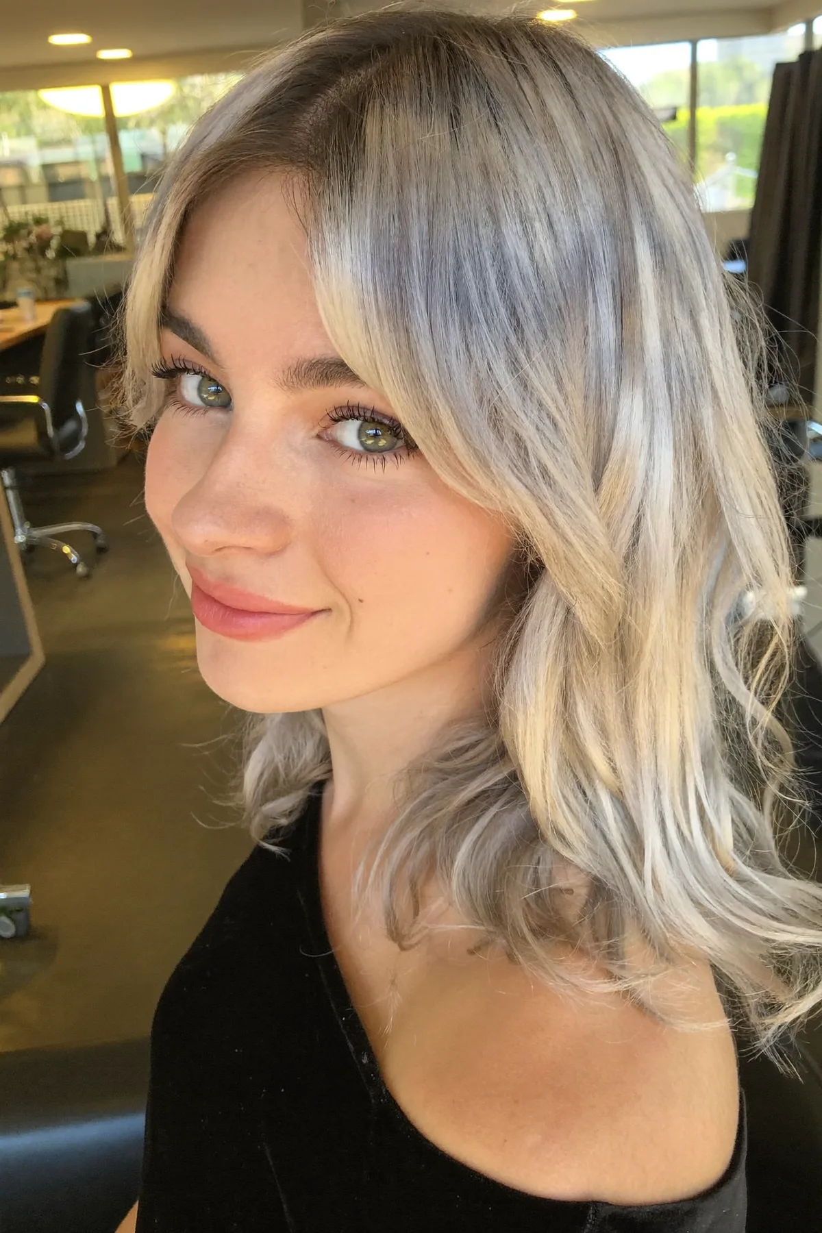 Soft Ash Silver with Face-Framing Long Layers and Curtain Bangs