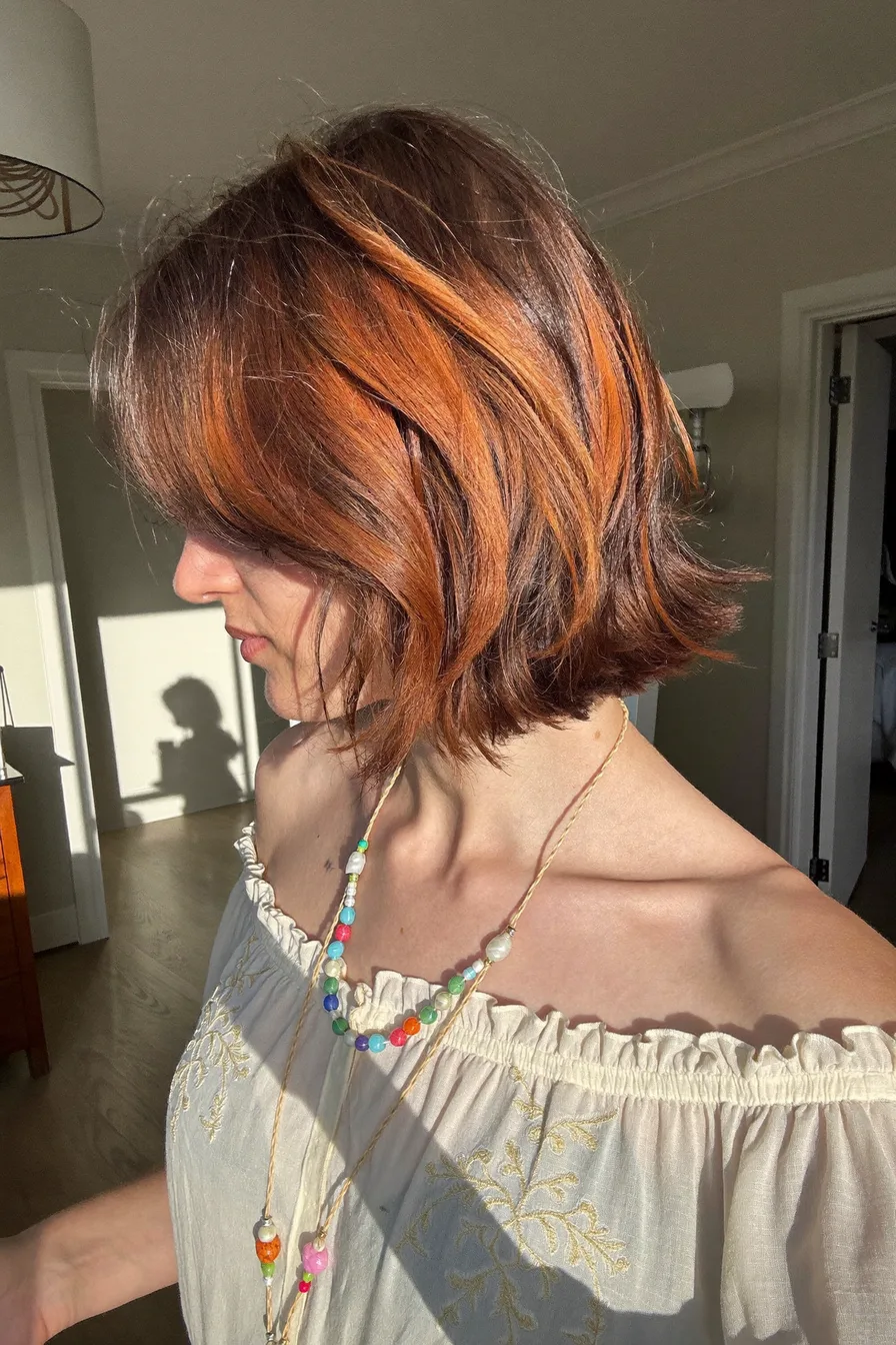 Textured Choppy Bob with Copper Balayage and Side-Swept Bangs