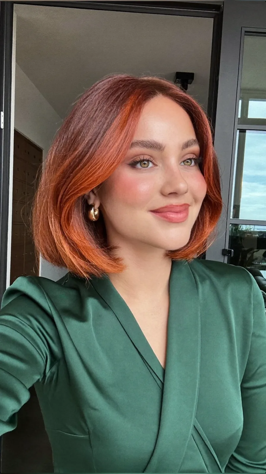 Chin-Length Classic Bob with Curtain Bangs and Copper Highlights