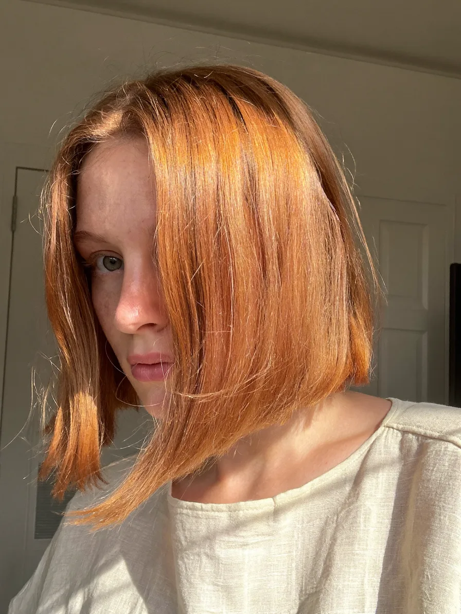 Sleek Warm Copper Blunt Chin-Length Bob with Side Part