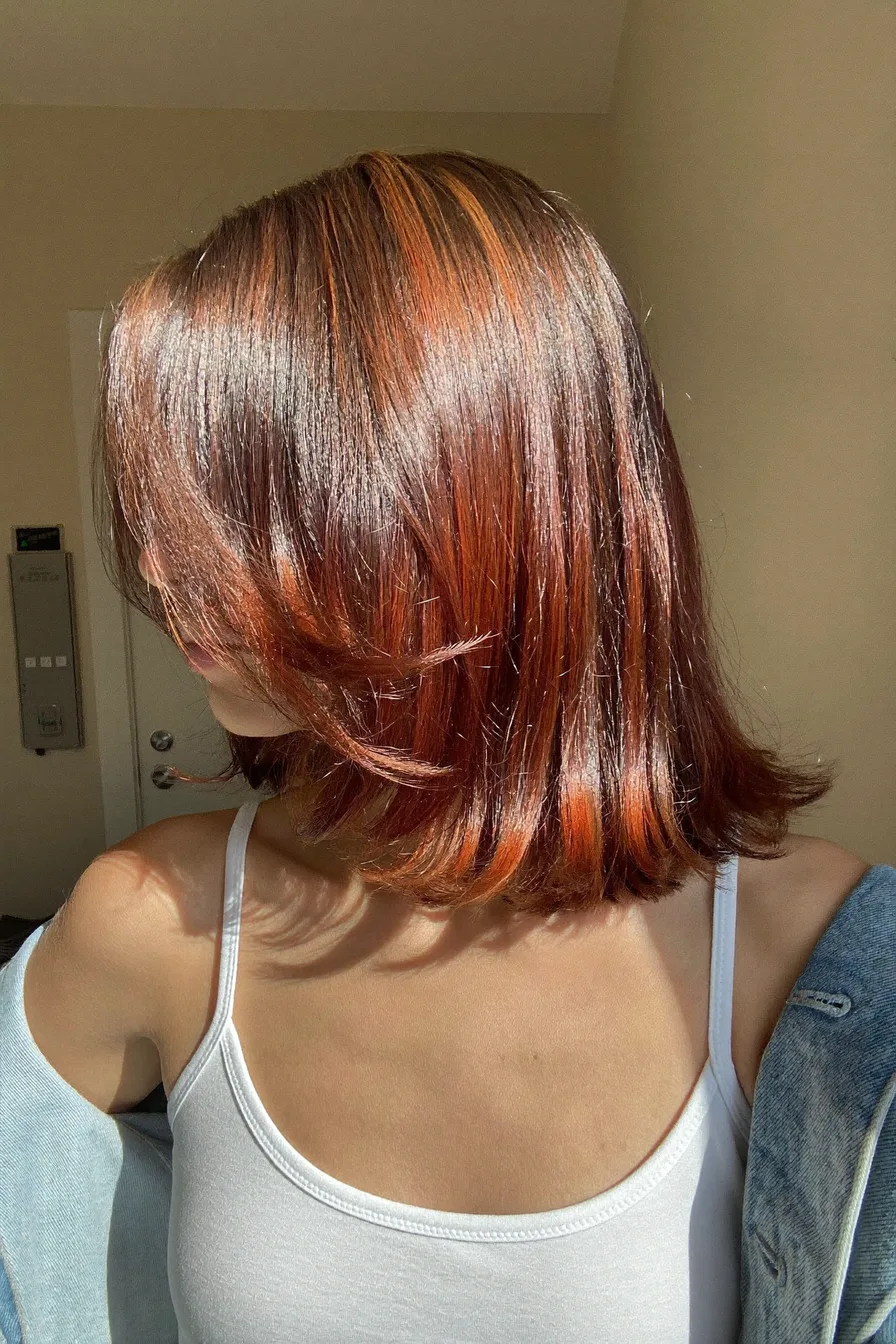 Sleek Chin-Length Blunt Bob with Soft Flicked Ends