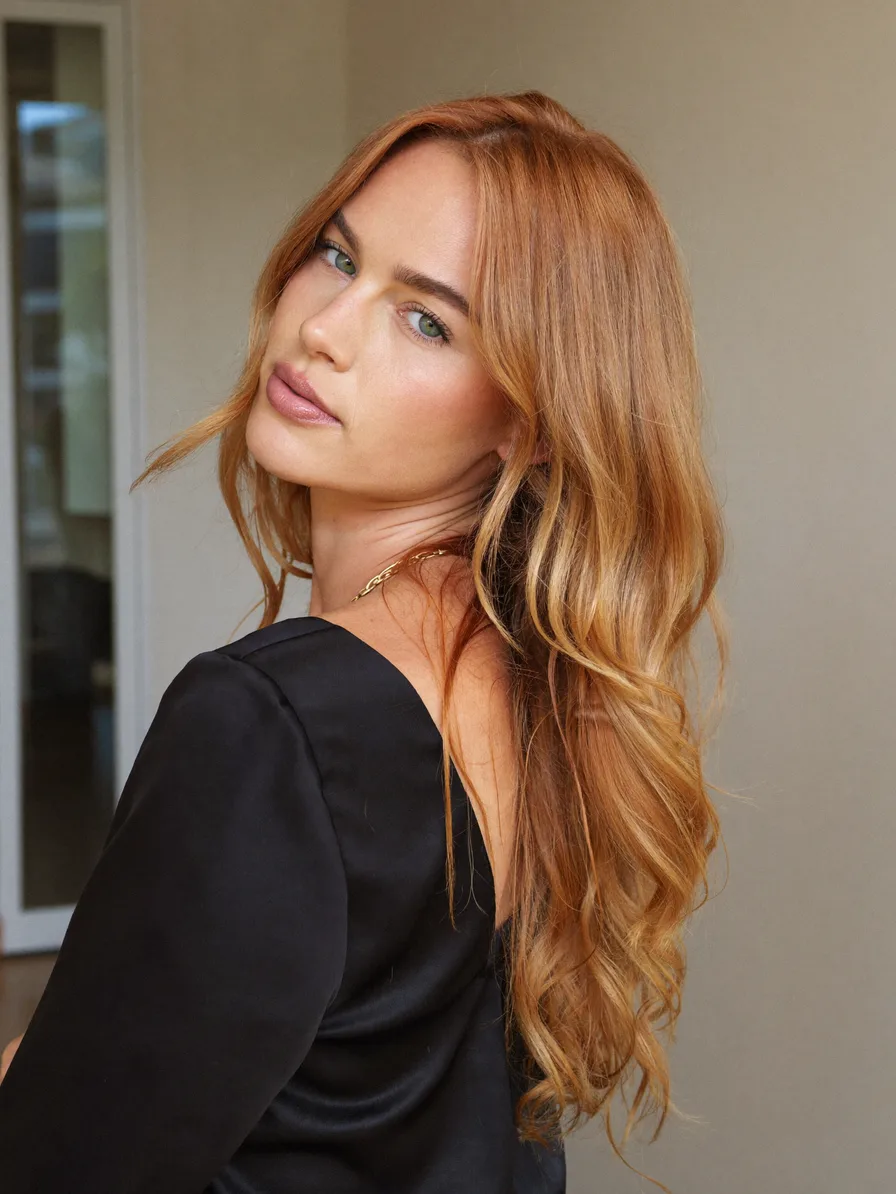 Long Layered Auburn Hair with Flowing Curtain Bangs
