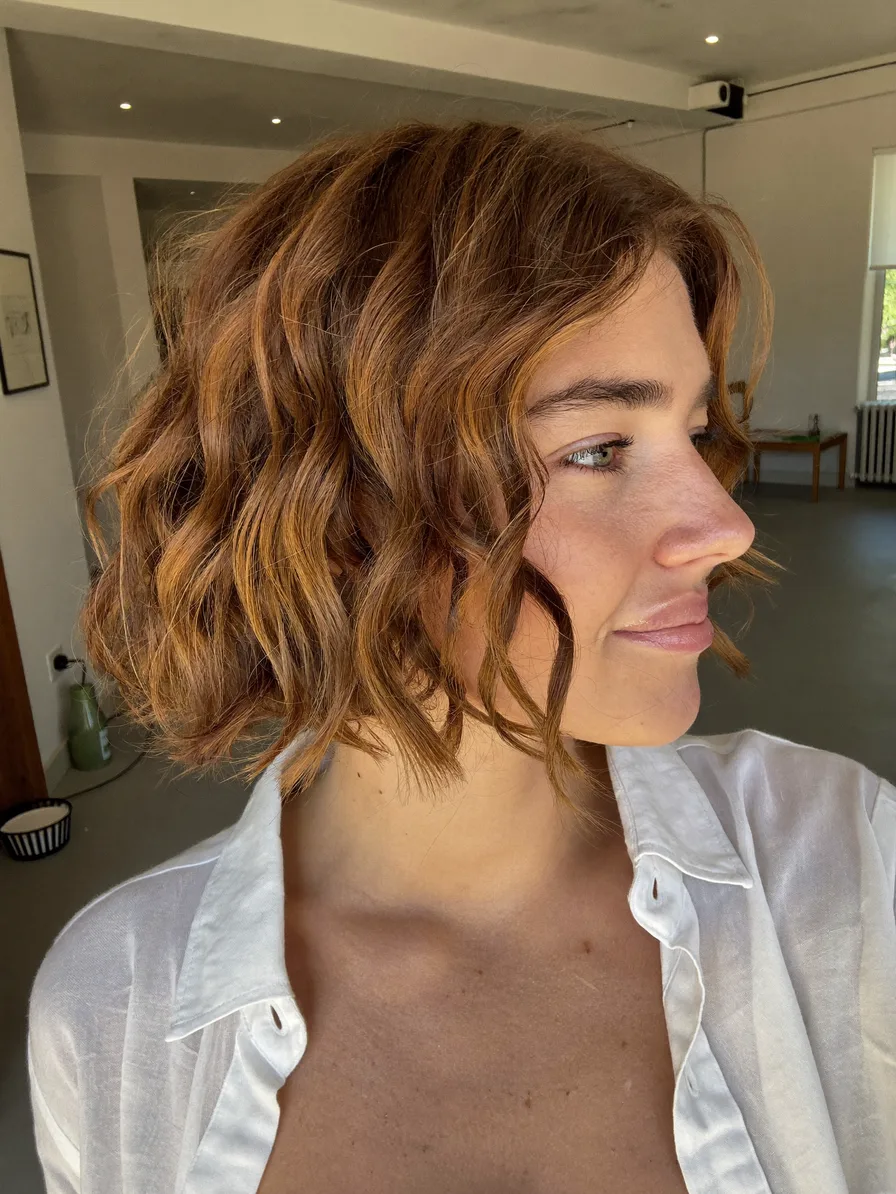 Choppy Textured Bob with Side-Swept Bangs and Balayage Highlights