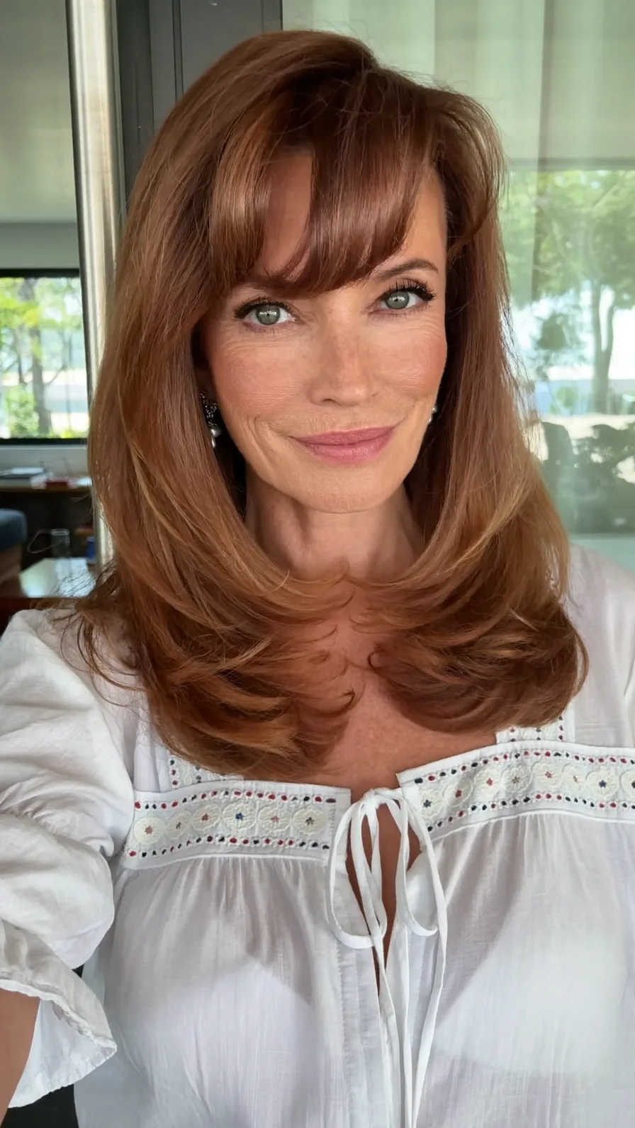Elegant Medium-Length Hair with Blunt Feathered Bangs