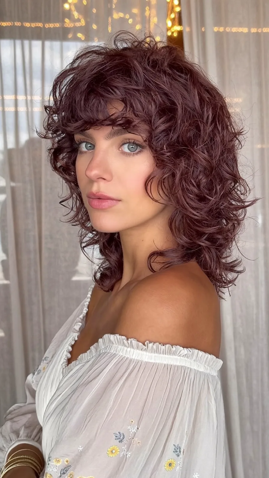 Voluminous Curly Shag with Curtain Bangs for Shoulder-Length Hair