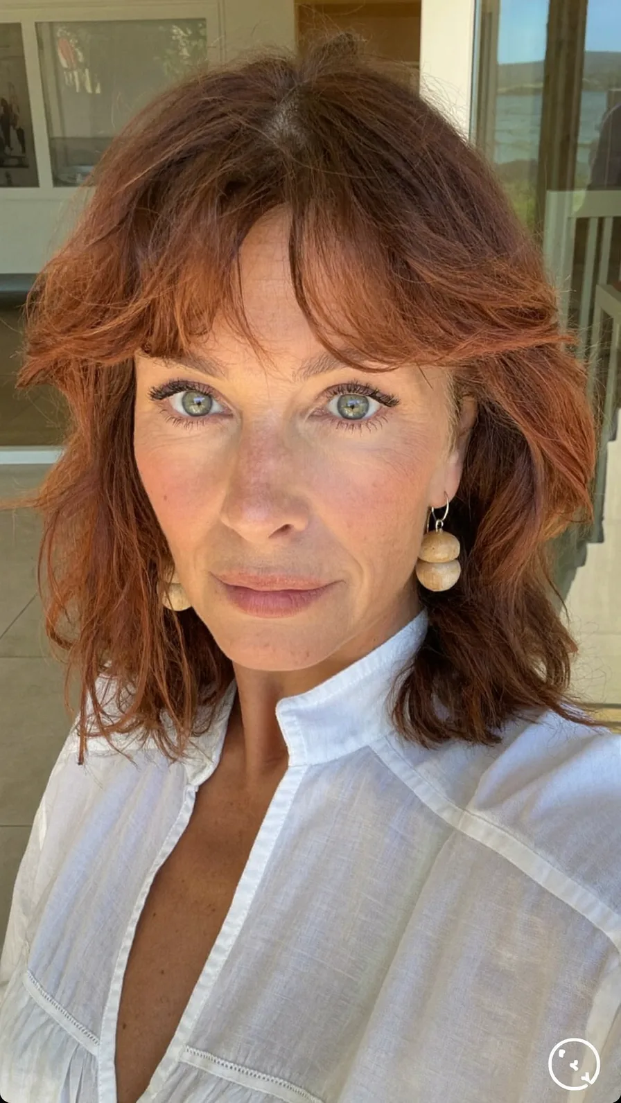 Shoulder-Length Layered Lob with Flowing Curtain Bangs