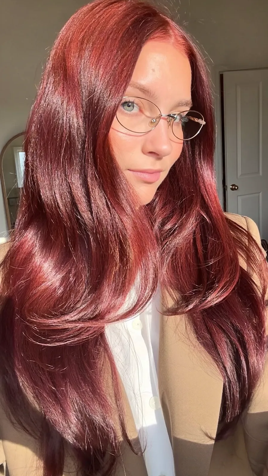 Sleek Long Auburn Layers with Center Part and Natural Shine