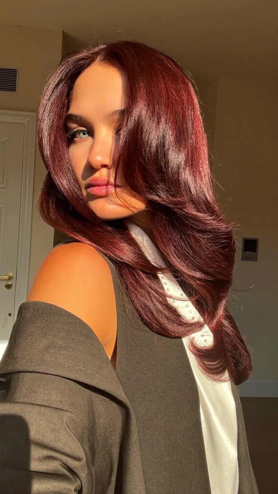Elegant Long Auburn Hair with Soft Feathered Layers