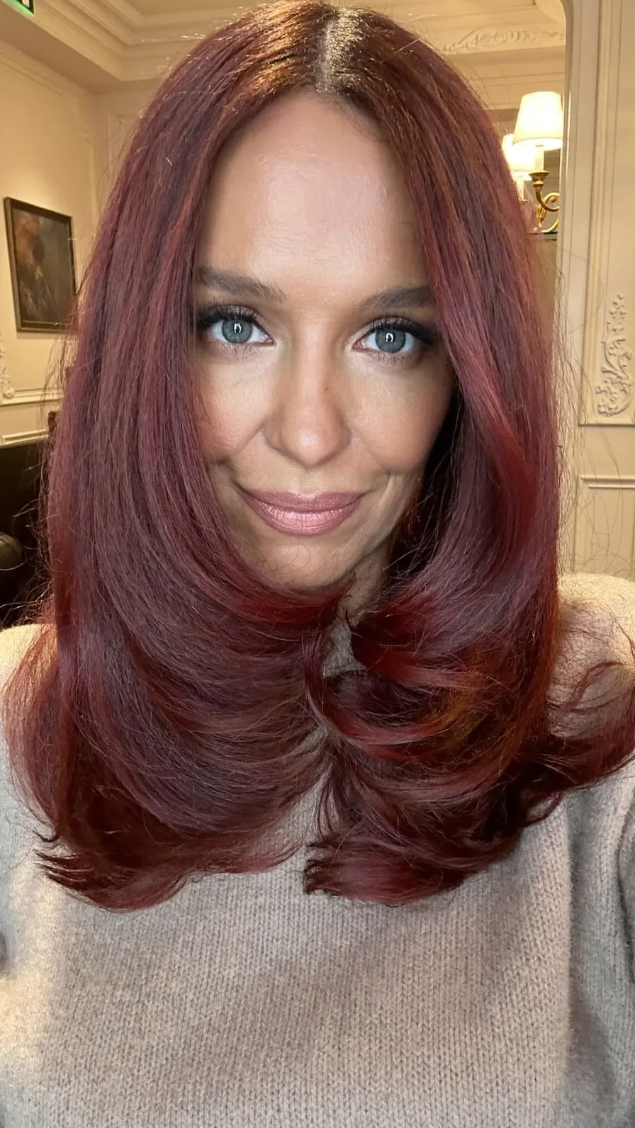 Rich Auburn Long Layers with Center Part and Rounded Ends