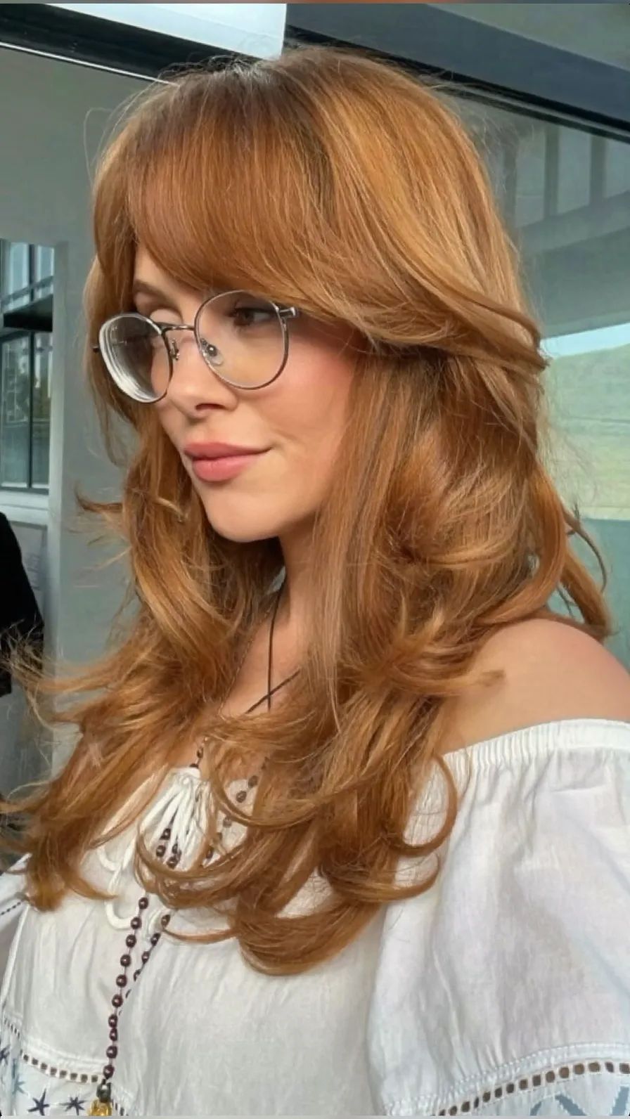 Voluminous Auburn Layers with Flowing Curtain Bangs